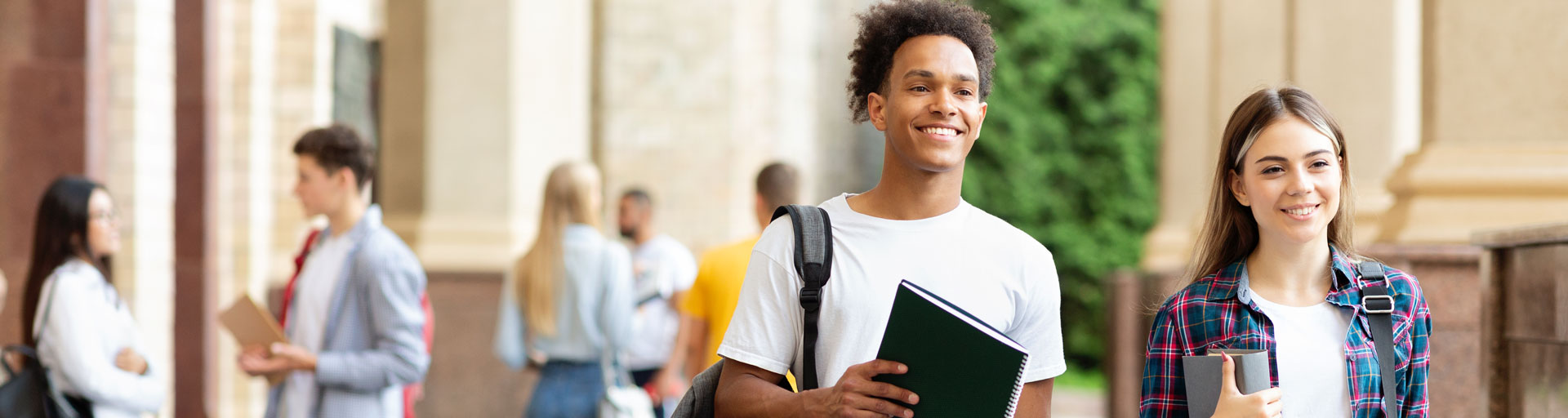 Two students walking on campus